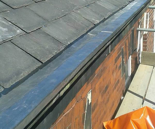 roofing work - stone guttering repairs after
